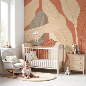 Botanical leaves mural wallpaper creating serene nursery atmosphere with warm beige and terracotta tones by Kids-Mundo