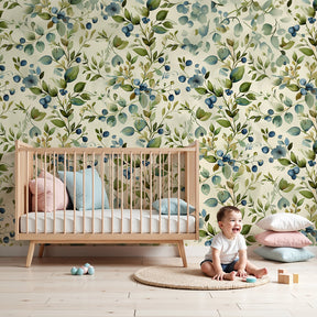 Botanical mural wallpaper with green leaves and blue berries in modern nursery by Kids-Mundo