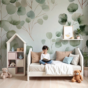 Botanical foliage mural wallpaper in serene baby nursery with natural green tones by Kids-Mundo