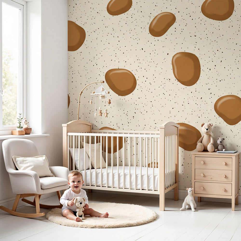 Kids-Mundo brown pebble pattern wall mural styled behind a cot in a warm, natural nursery
