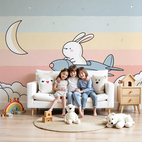 Bunny aviator mural wallpaper in serene baby nursery with white crib by Kids-Mundo