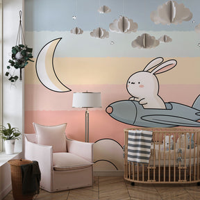 Dreamy cloud bunny wallpaper creating peaceful atmosphere in modern toddler bedroom