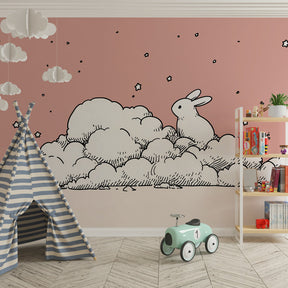 Cloud bunny mural wallpaper transforming toddler room into magical sleep space