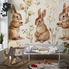 Nature-themed bunny mural wallpaper in bright toddler room with soft furnishings