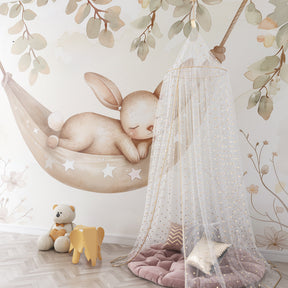 Star bunny mural wallpaper complementing nursery furniture and creating magical baby room decor