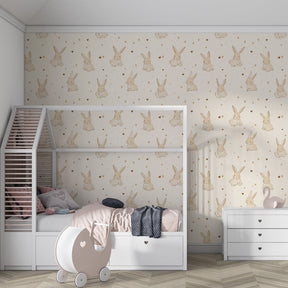 Animal-themed bunny wallpaper transforming kids playroom with soft beige and golden accents