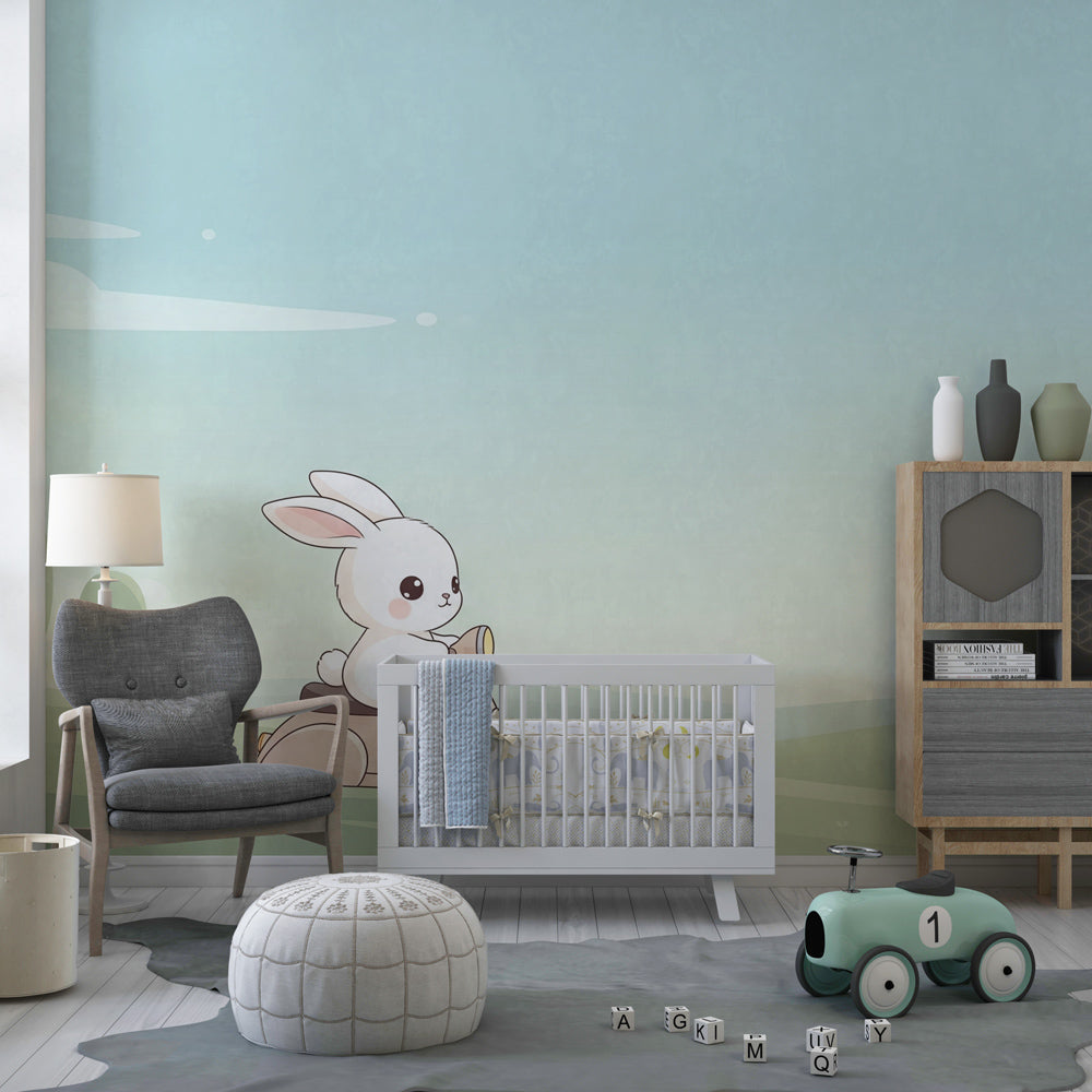 Whimsical bunny mural wallpaper with soft blue and green tones in toddler's room