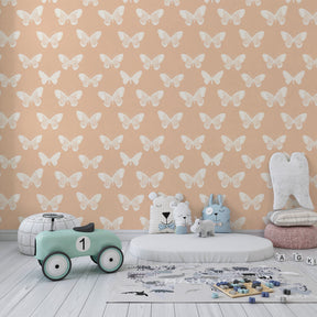 Soft pastel butterfly wallpaper creating magical atmosphere in children's bedroom interior