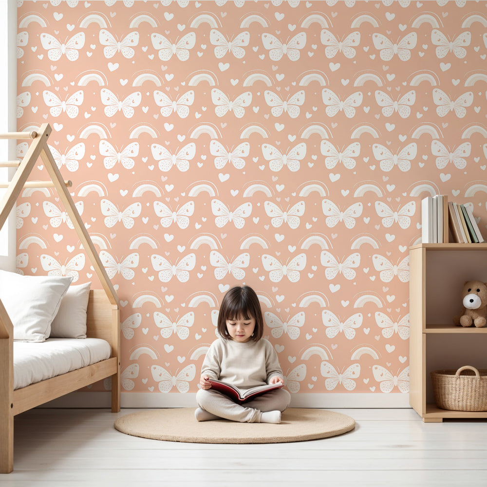 Butterfly rainbow mural wallpaper creating magical nursery atmosphere with peach tones by Kids-Mundo