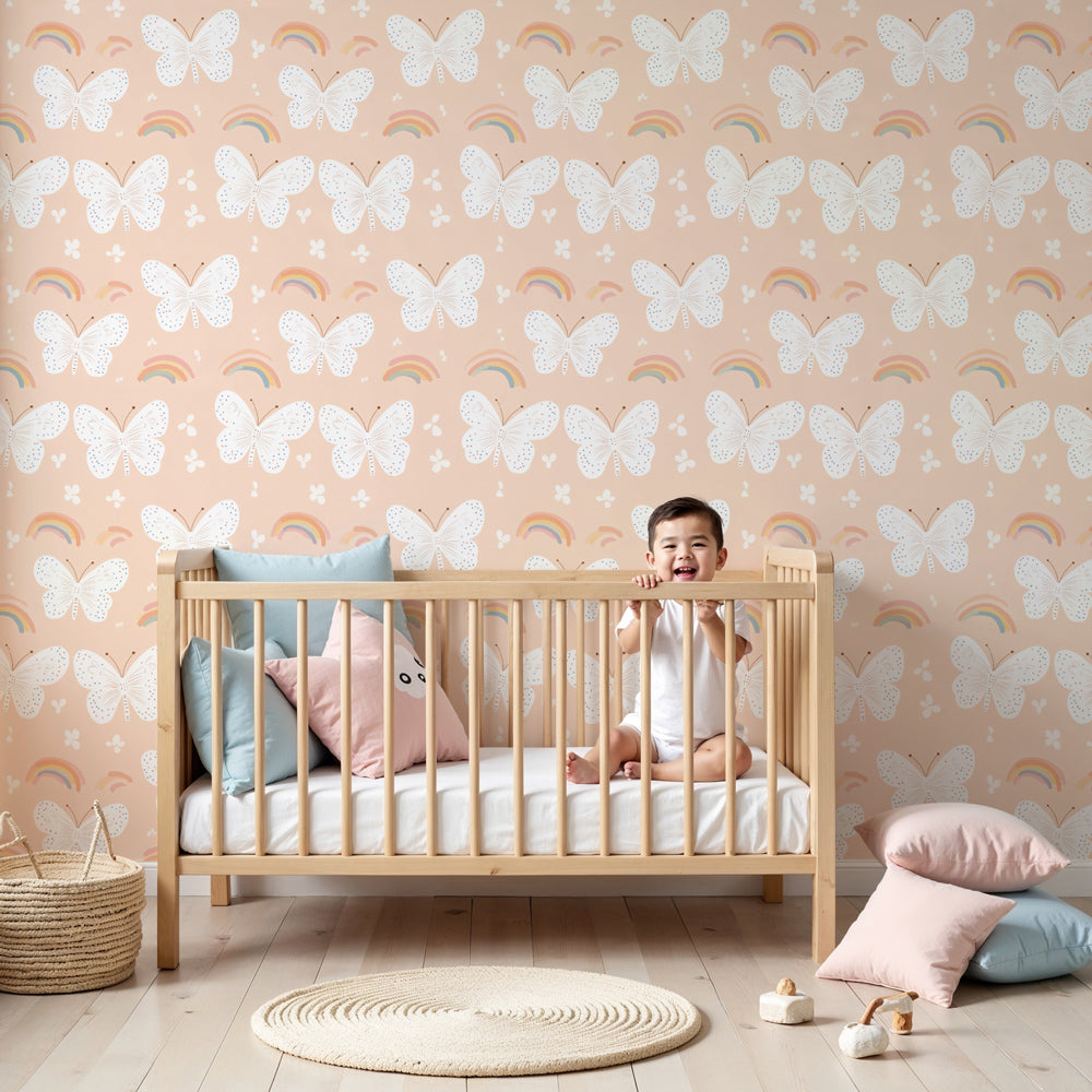 Butterfly rainbow mural wallpaper creating magical nursery decor with pink background by Kids-Mundo