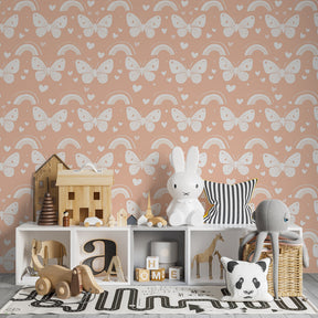 Whimsical butterfly wallpaper with rainbows decorating cozy toddler bedroom by Kids-Mundo