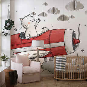 Red airplane cat mural wallpaper creating adventure theme in children's playroom space