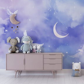 Dreamy celestial wallpaper creating magical atmosphere in toddler bedroom with doves and moon