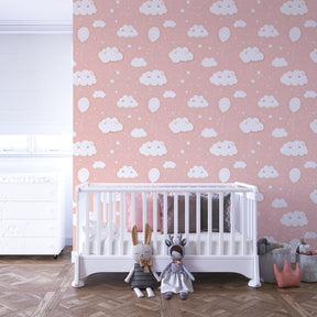 Cloud balloon wallpaper creating dreamy atmosphere in children's bedroom with soft lighting