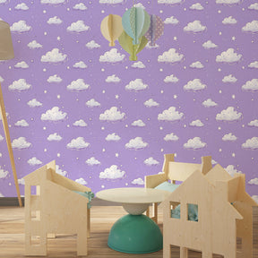 Soft cloud wallpaper with stars transforming children's bedroom into magical sky sanctuary
