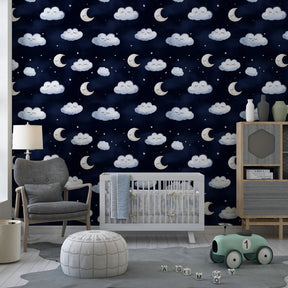 Night sky wallpaper with clouds and moons creating peaceful kids bedroom decor