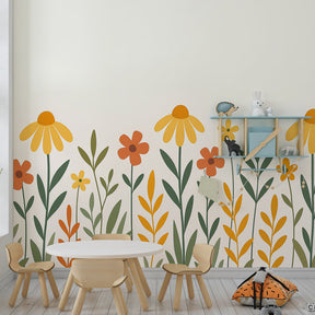 Vibrant flower wallpaper transforming kids playroom with yellow and orange blooms