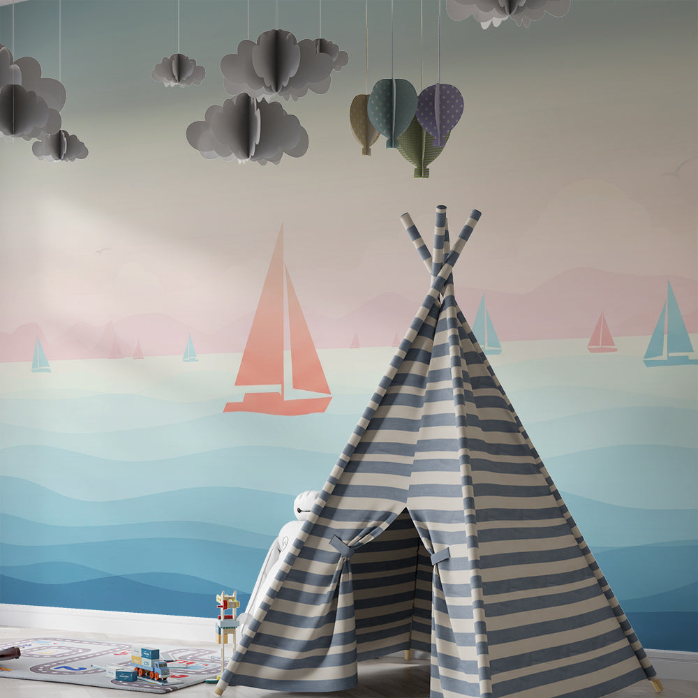 Kids-Mundo colourful sailboats wall mural in a playroom, made-to-measure wallpaper with a pastel sunset sea.
