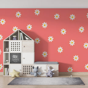 Coral and white floral wallpaper creating warm atmosphere in kids playroom interior