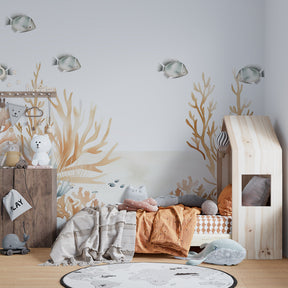Ocean themed mural wallpaper featuring silver fish and coral patterns in modern baby room