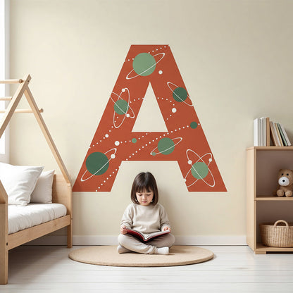 Kids-Mundo cosmic letter A wall mural styled in a cream and terracotta nursery