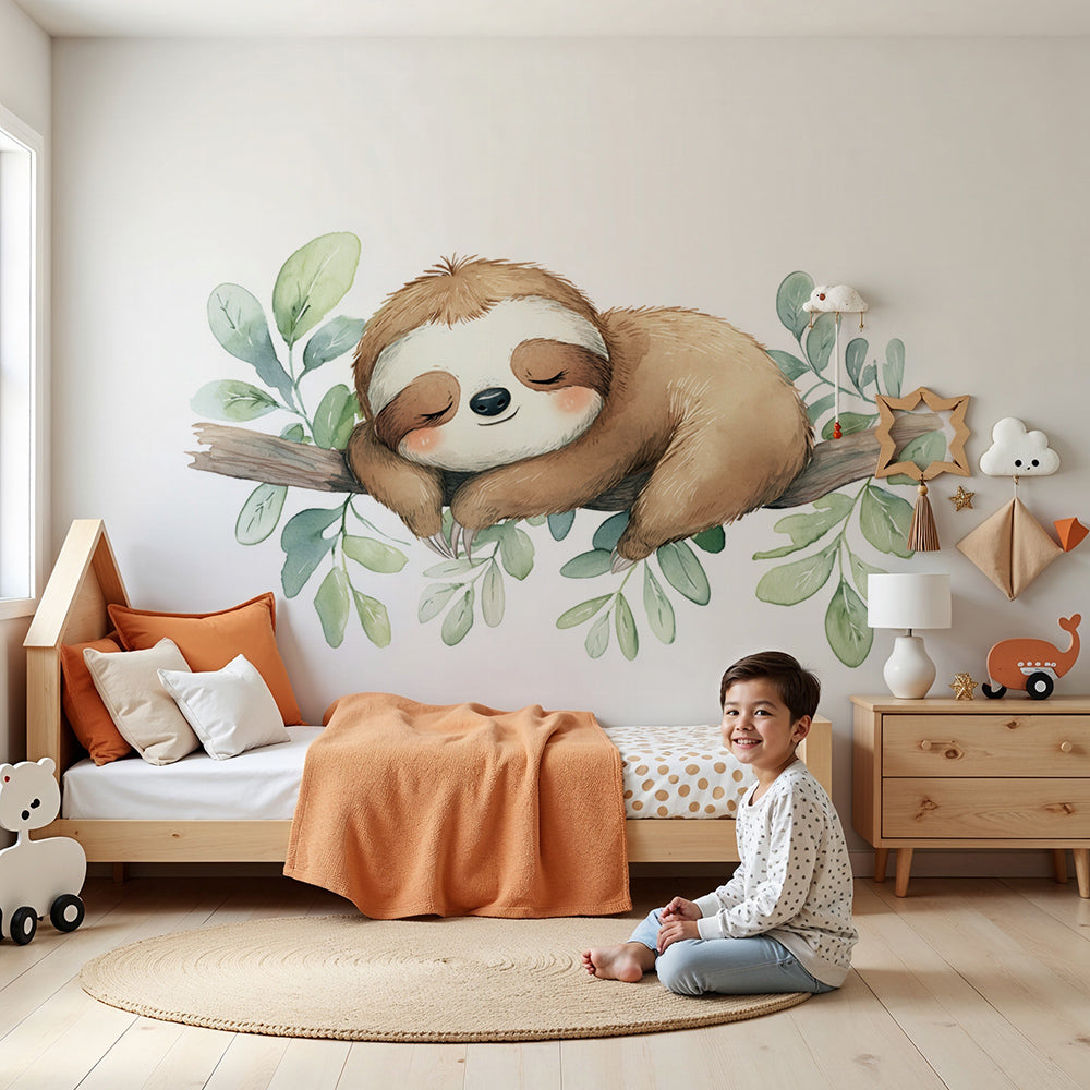 Kids-Mundo curled-up sloth wall mural styled in a calm green nursery with soft watercolour leaf details.