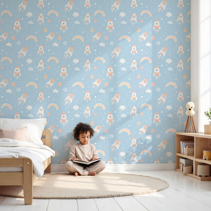 Kids-Mundo astronaut pattern wall mural fitted above a cot in a soft blue nursery