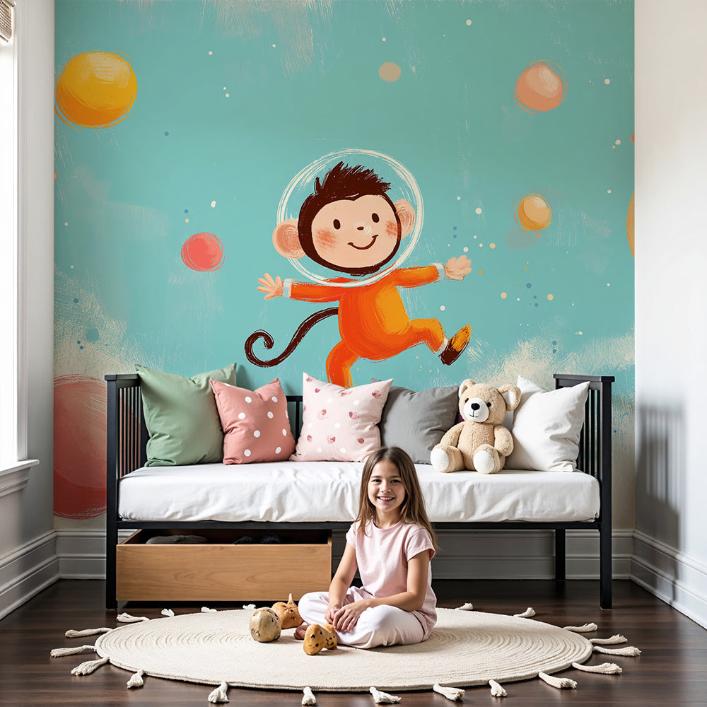 Kids-Mundo monkey astronaut space mural styled on a nursery wall with soft teal tones.