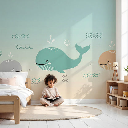 Kids-Mundo pastel whales wall mural in a calm nursery, made-to-measure baby wallpaper behind a cot.