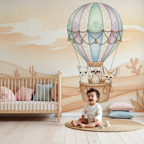 Desert animals hot air balloon mural wallpaper in modern nursery with wooden crib by Kids-Mundo