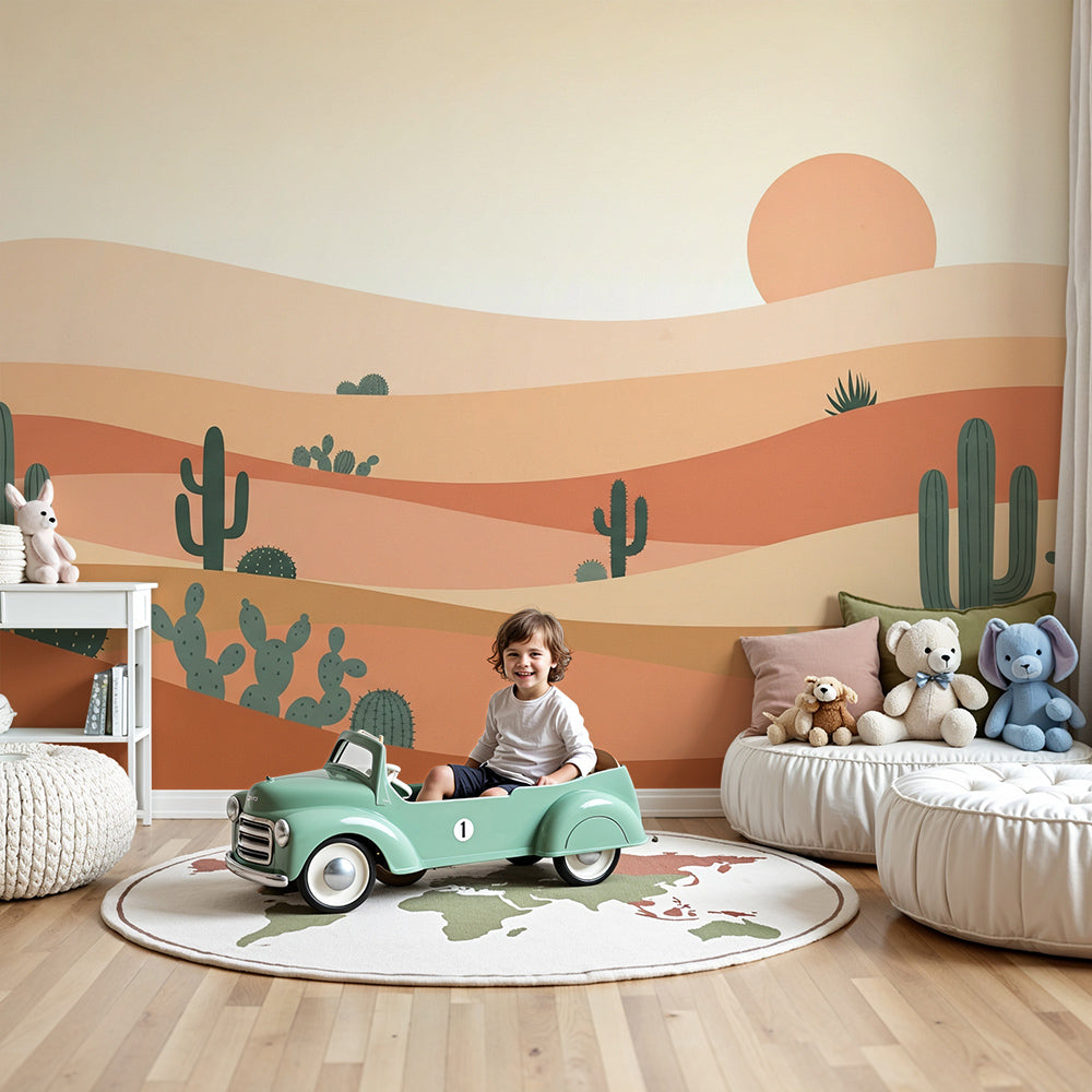 Kids-Mundo terracotta desert wall mural with cacti and sunset styled above a cot in a warm nursery