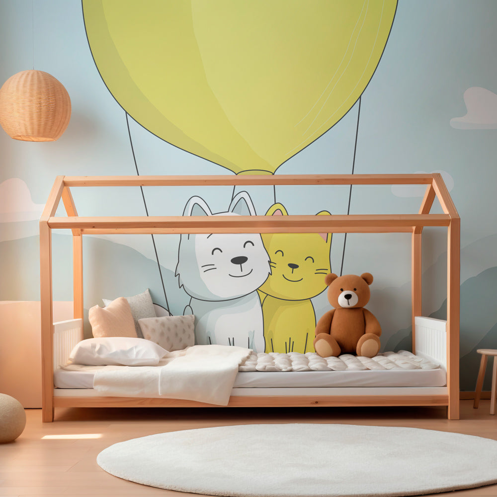 Playroom wall decorated with whimsical hot air balloon adventure mural wallpaper