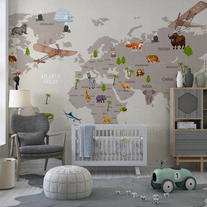 Kids-Mundo animal world map mural covering a kids bedroom wall, showing labelled countries, oceans and wildlife