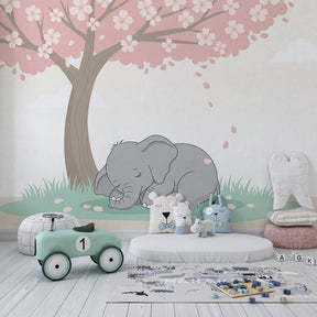 Safari elephant wallpaper with pink cherry blossoms creating serene children's bedroom decor