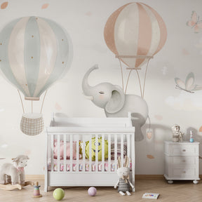 Pastel elephant and balloon wallpaper creating peaceful baby bedroom decor