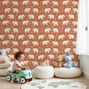 Elephant mural wallpaper creating warm safari-themed nursery decor with terracotta background by Kids-Mundo