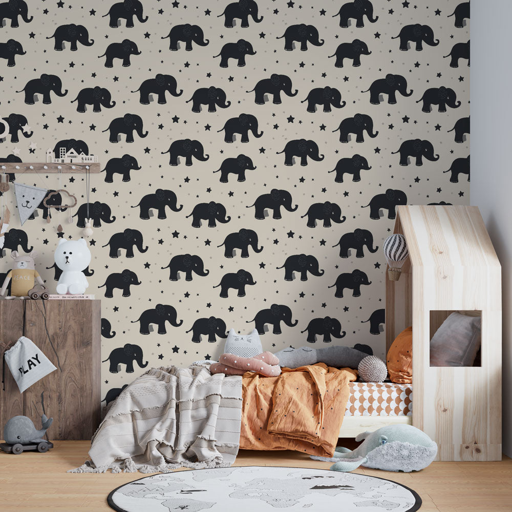 Safari elephant wallpaper transforming toddler room with playful black elephants and stars