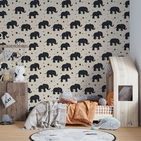 Safari elephant wallpaper transforming toddler room with playful black elephants and stars