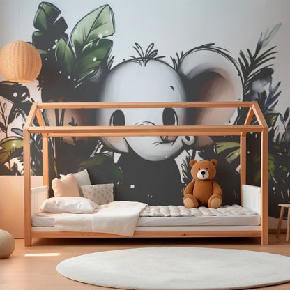 Kids-Mundo elephant peeking through leaves mural brightening a lively playroom wall