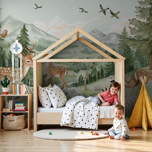 Kids-Mundo enchanted forest deer wall mural styled behind a cot in a soft green nursery