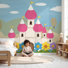Pink fairytale castle mural wallpaper in bright children's nursery with white furniture by Kids-Mundo