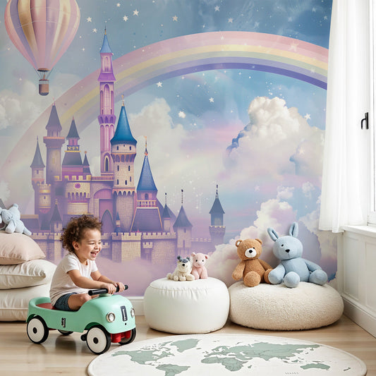 Kids-Mundo fairytale castle and rainbow wall mural behind a cot in a soft pastel nursery.