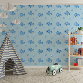 Blue fish and bubbles mural wallpaper transforming kids playroom into underwater world