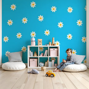 White daisy mural wallpaper creating cheerful nursery decor with blue background by Kids-Mundo
