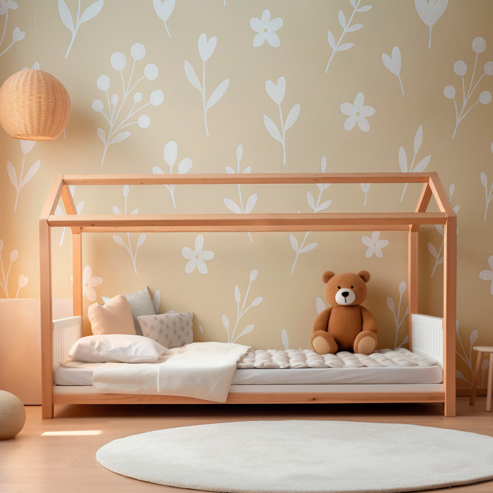 White flower mural wallpaper on beige background in bright kids playroom by Kids-Mundo