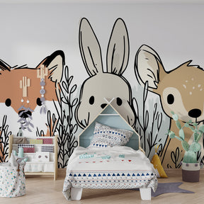 Woodland themed mural wallpaper creating magical children's bedroom atmosphere