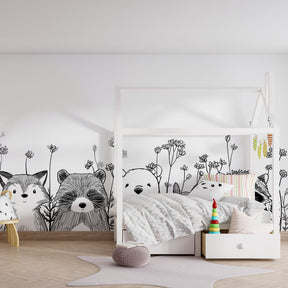 Woodland creatures wallpaper creating cozy children's bedroom atmosphere with fox and bear