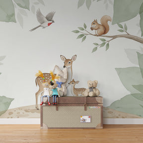Nature themed mural wallpaper featuring mother deer and fawn in kids playroom environment