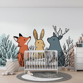 Forest animals wallpaper with soft pastels transforming kids playroom into woodland retreat