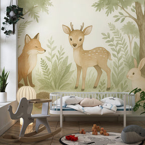 Forest animal themed mural wallpaper in children's playroom with soft pastel colors